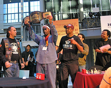 RZA holds up the HHCF championship belt after sweeping the tournament 4-0. Hip-hop legend Poppin Fabel presents the belt while Adisa Banjoko (co-founder of HHCF), Josh Waitzkin and Rakaa Iriescience applaud. Photo by Daaim Shabazz.