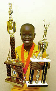 Tewana Mellace showing off his trophies from the 2007 Miami Orange Bowl.