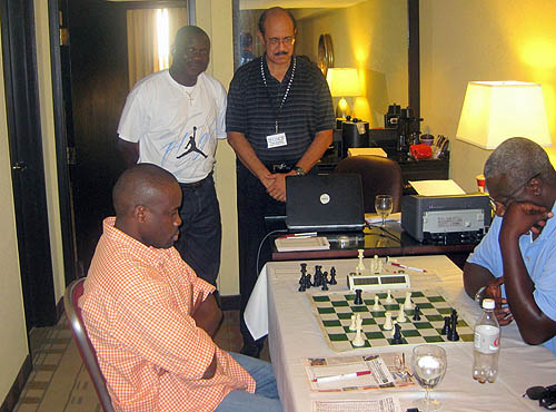 Bola and Francis watching IM Oladapo Adu topple NM George Umezinwa.