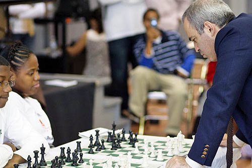 Kasparov squaring off against Medina Parrilla, U.S. Girl's Champion. Photo by Harlem Children's Zone.