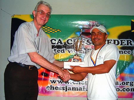 Shane Matthews (r) accepts the winners trophy from Robert Wheeler.