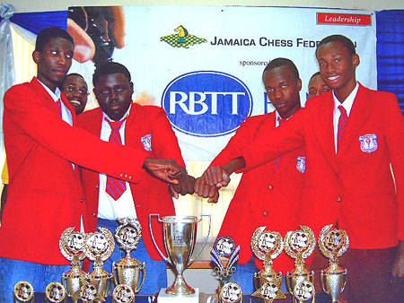 Camperdown: (L-R) Peter Thomas (Capt.), Warren Cornwall, Damion Davy and Rayon Walters touch fists in celebration. Coach National Master Equitable Brown (background left) and reserve O’Shane Reid (backgrond right).