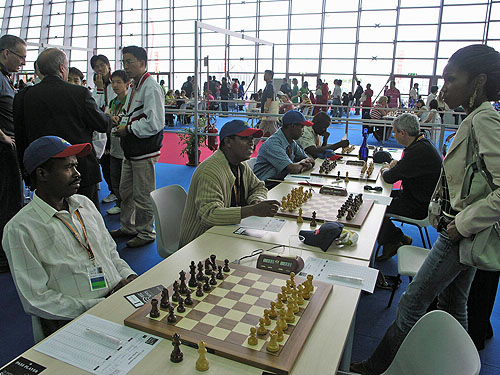 Haitians preparing to pawn off in round #1 of 2006 Olympiad in Turin, Italy. Photo by Daaim Shabazz.