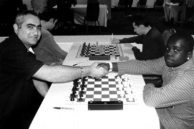 Giorgi Kacheishvili facing 12-year old Master Justus Williams in round one. Photo from uschess.org.