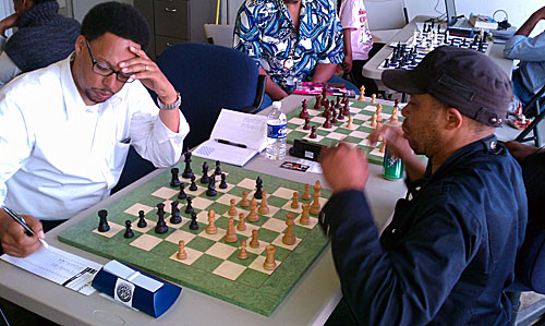 Frank Johnson playing Iyobebe Hanson at 64 Squares Chess Club.  Photos by Daaim Shabazz.