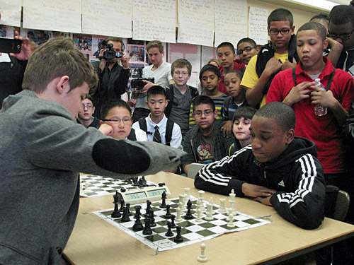 Carlsen attempts to hold off James Black, Jr. Photo by Elizabeth Spiegel.