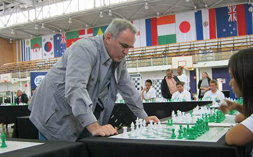 Garry Kasparov conducting a simultaneous exhibit in South Africa during a 2012 visit.