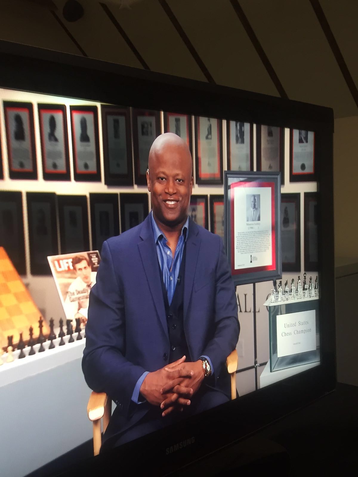 GM Maurice Ashley at the World Chess Hall of Fame with his plaque. Photo courtesy of Maurice Ashley
