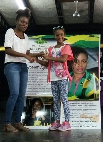 Deborah Richards-Porter presenting trophy to one of the prize winners of her tournament.