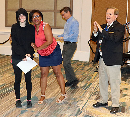 Robin Ramson presenting upset prize to Haring participant. David Guimand and Dewain Barber also pictured. Photo by Daaim Shabazz.