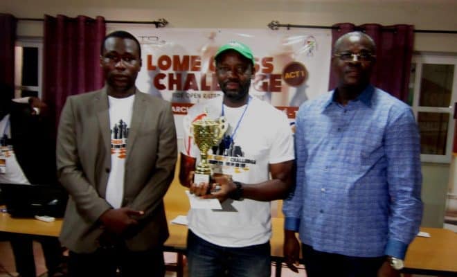 In happier times, Adu winning Lomé Chess Challenge. Commissioner Abalou Bodjona (left) and Togolese Vice President Abby Edah Ndjelle flank the Nigerian Eagle. Photo by Simeon Egbade.