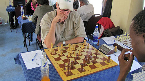 Peter Gilruth inflicting punishment on Akello.