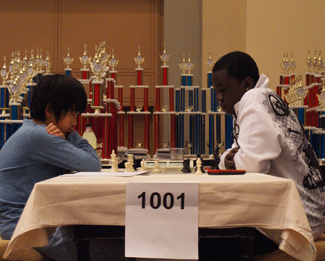 Benjamin Moon facing Justus Williams. Both scored 6/7 with two others, but Williams would go on to win on tiebreaks. Photo by Shaun Smith.