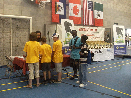 Justus and Joshua checking with the Arbiters. Photo by Guy Colas.