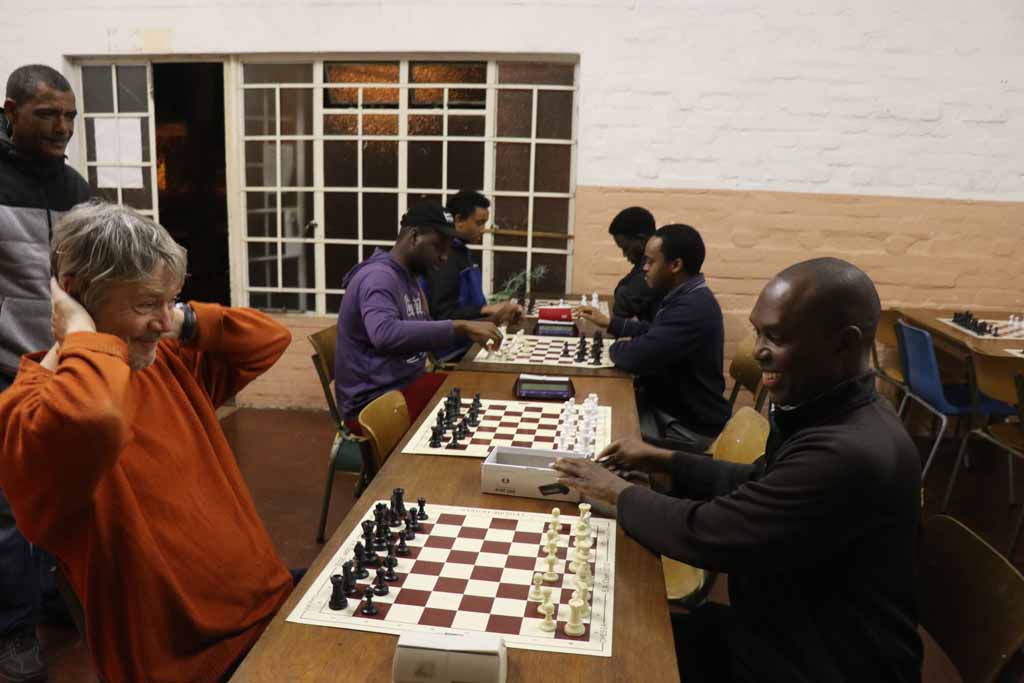Playing Charles De Villiers at the Claremont Chess Club in Capetown. Photo by Daaim Shabazz.