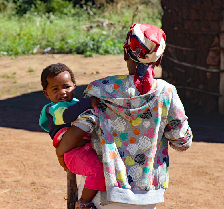 Mother and child in the village. Photo by Daaim Shabazz.