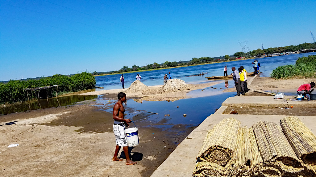 Workers actually packing products for export. Photo by Daaim Shabazz.