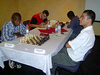 Daniel Jere facing off against IM Aimen Rizouk at the 2005 African Individual Chess Championships.