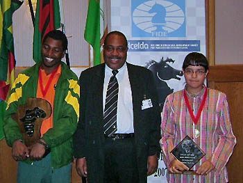 IM Robert Gwaze and WIM Mona Khaled are crowned as the new African Championships. FIDE Vice-President Lewis Ncube offers official congratulations.Copyright  2007 Namibian Chess Federation.