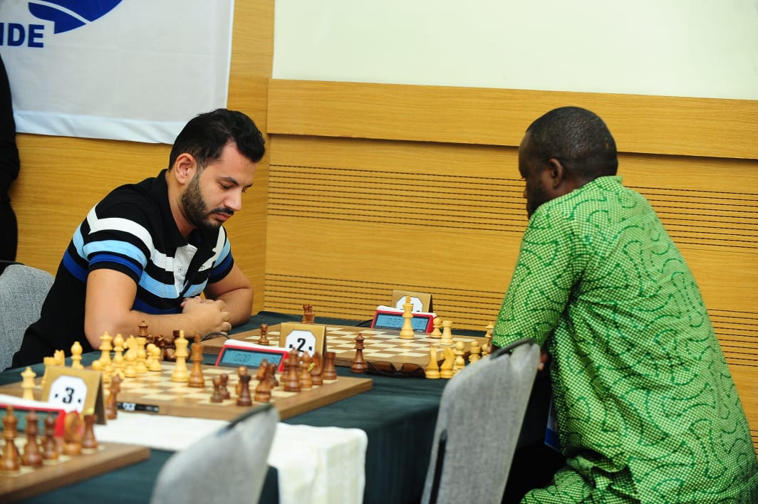 Tournament of Streaks: Ahmed Adly battling Oladapo Adu. Adly would lose this game, but later win five in a row to clinch the silver. Adu was 3/3, but lost his next three games falling off the medal pace. Photo by Mohamed Bounaji