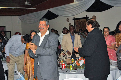 Dinner attendees give Anand a standing ovation.