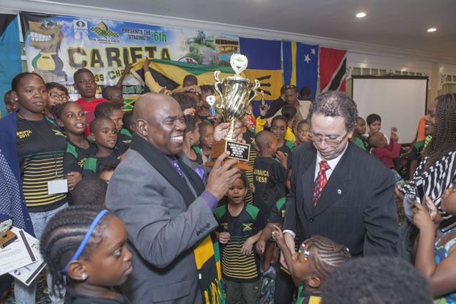 Ian Wilkinson accepts team trophy for Jamaican team!