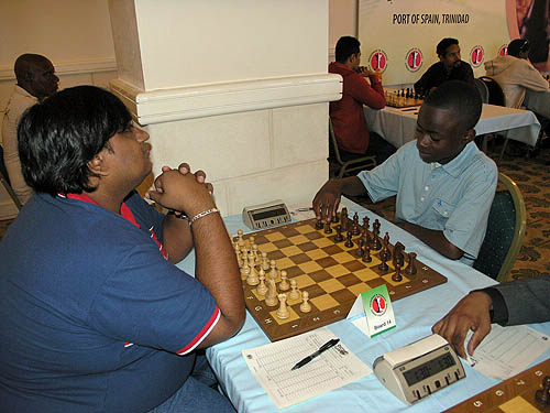 Josh Colas about to start his first international game against Ravishen Singh of Trinidad. The game was drawn.