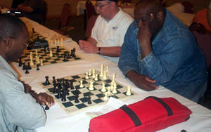 Daaim Shabazz analyzing with old chess partner, NM Marvin Dandridge. Copyright © 2003, Daaim Shabazz