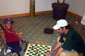 4-year old  Jayel Taylor claiming a draw in a skittles game.