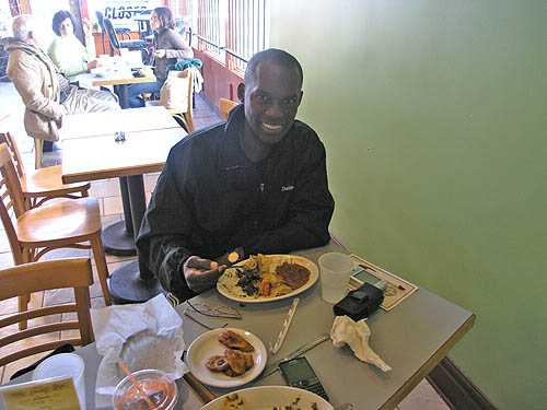 I know, I know... you eat Ethiopian food with your hands, but we ran out of injera bread! :-) It was on the way, but I couldn't wait. Photo by Daaim Shabazz.