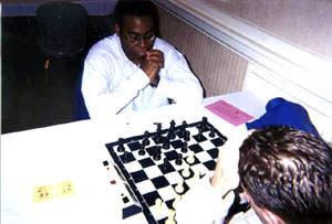 Okechukwu Iwu scored 6/7 to tie for 1st in the U2200 section. Here he defeats Ben Johnson in his 6th round encounter. Copyright  2002, Daaim Shabazz.