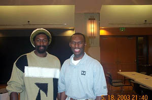 Negash Bezaleel with The Chess DrumÂ’s  Daaim Shabazz. Bezaleel won the top under-2200 prize. Copyright Â© 2003, Daaim Shabazz
