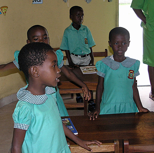 Students singing a song for the guests.