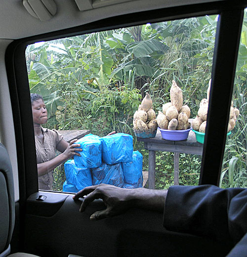 Kenkey and yams are being sold on the roadside. Kenkey is a Ghanaian staple an is made of fermented maize (corn) or cassava.