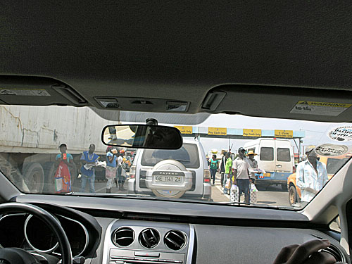 Hordes of street vendors provide car-to-car service. You can buy virtually anything. In a place where the roads are not in good shape, this may be the best mode of distribution.