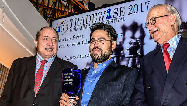 Hikaru Nakamura receives his winners cheque for £23,000 and trophy from Tradewise Chairman James Humphreys (left) and Tradewise Chess Festival Organiser Brian Callaghan. Hikaru scored 8/10 (+6,=4) and then won a playoff 1½-½ to take first prize. Photo © John Saunders