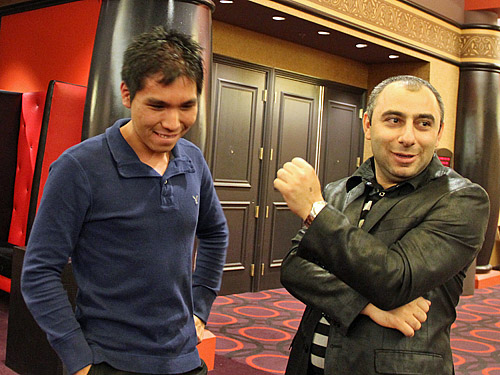 GM Varuzhan Akobian helping Wesley So celebrate. Photo by Daaim Shabazz.