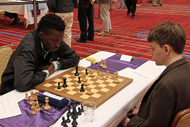 FM Daniel Anwuli vs. GM Conrad Holt. Photo by Daaim Shabazz.