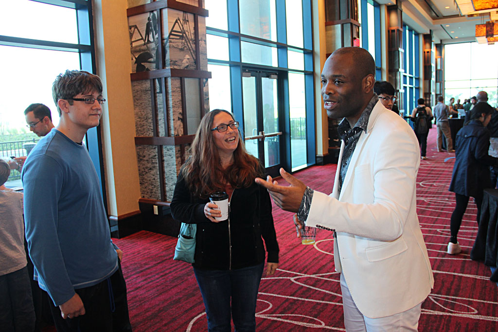 GM Pontus Carlsson (right) chatting with GM Samuel Sevian and his mother.