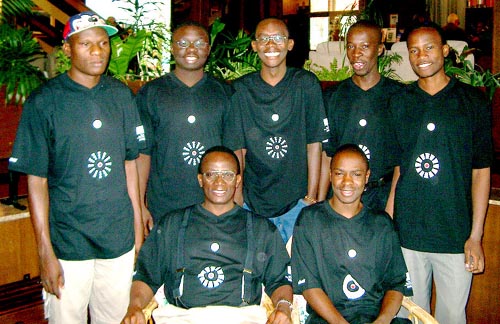 Uganda's 2002 Olympiad Team: (front row, from left to right) Daniel Nsimbambi (Captain) and Grace Nsubuga (Bd. 1); standing are (left to right) Shadrack Kantinti (Bd. 2), Ignatius Wanderama (Bd. 4), Isaak Munanira (Bd. 5) and Emmanuel Mwaka (Bd. 6), Steven Male Kawuma (Bd. 3). Photo by Jerry Bibuld.