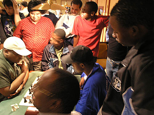 Jamaicas Duane Rowe against  Botswanas Ignatius Njobvu in a Blitz Challenge. Players were challenging other countries in a best of three. These pictures were taken in the lobby of the Hotel Acorn Pionero and when I left for my hotel (Mirlos Tordos), it was about 3:00am. They were still playing!