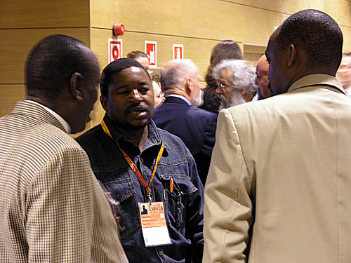 Malawi's Kezzie Msukwa (center) with Uganda's Enoch Barumba and Rwanda's Rugema Ngarambe during the General Assembly at the 2004 Chess Olympiad in Calvia, Spain.