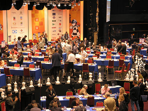 	
Tense moments at the 2004 Chess Olympiad as games were going late into the day. I was with a few of the Barbados players and we were watching to see if Kevin Denny would hold hold a draw. He did!