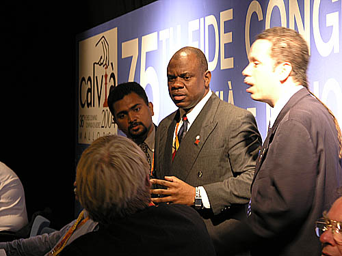 Derrick Perrera (Sri Lanka), Ian Wilkinson (Jamaica), Allan Herbert (Barbados) discuss issue with Morton Sand. Their plea was successful. Photo by Daaim Shabazz.