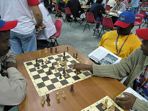 Haitians analyzing game during the 2006 Olympiad in Turin, Italy.