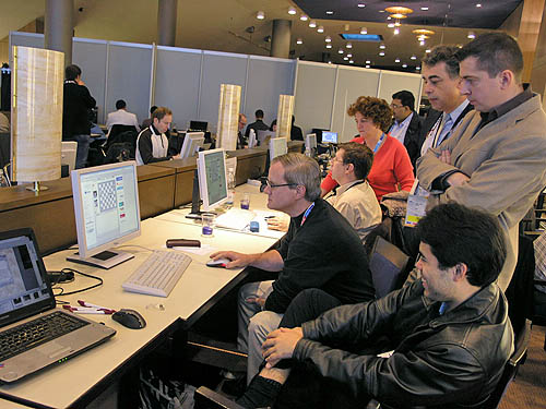 John Donaldson with USA team members calculating the tiebreaks. Yasser Seirawan Alexander Onischuk and Hikaru Nakamura (sitting) give input. Photo by Daaim Shabazz.