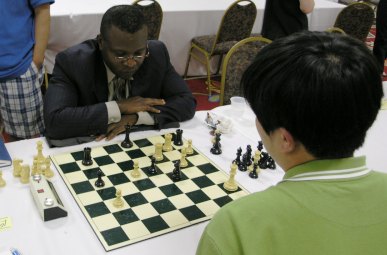 Sylvester Smarty vs. FM Bindi Cheng. Photo by Daaim Shabazz.