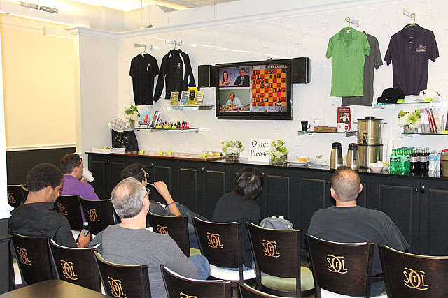 Spectators following action inside St. Louis Chess Club.
