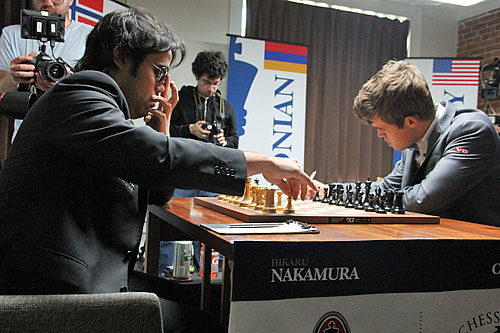 Hikaru Nakamura shielding glare from Carlsen's bright star.