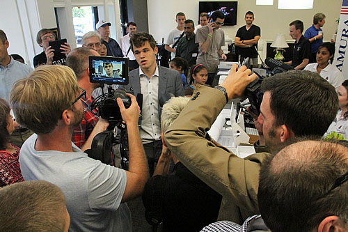 A mob scene around Carlsen included a Nordic TV station.